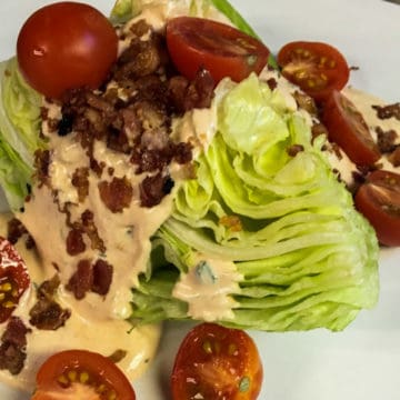 A wedge salad with bacon and a homemade chipotle ranch dressing.