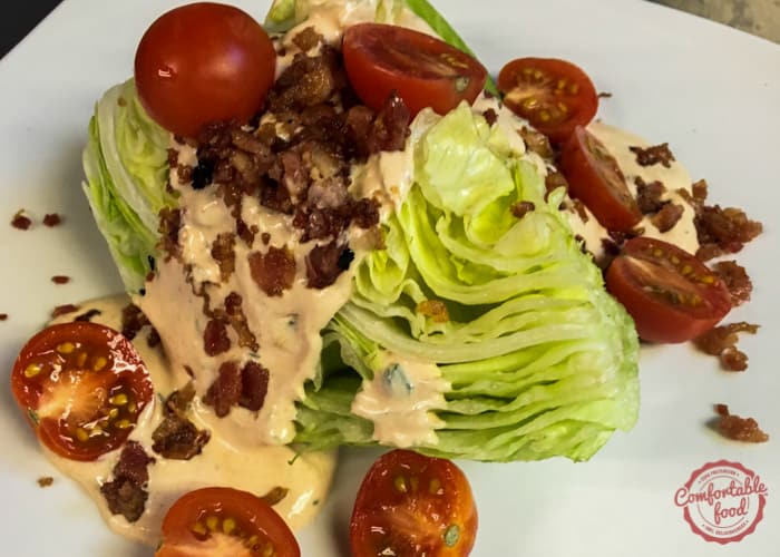 A wedge salad with bacon and a homemade chipotle ranch dressing.