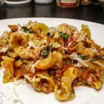 Hearty pasta with sausage and tomatoes recipe.