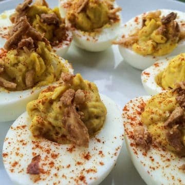Curried deviled egg recipe - the perfect spicy twist on a classic.