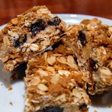 3 squares of Recipe for Triple Good Bars on White Plate