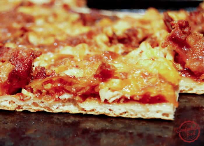 An easy homemade BBQ pizza with chicken and bacon.