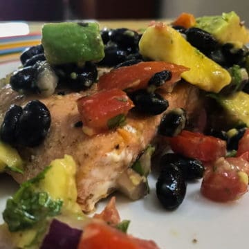 Light and healthy grilled salmon recipe with avocado black bean salsa.