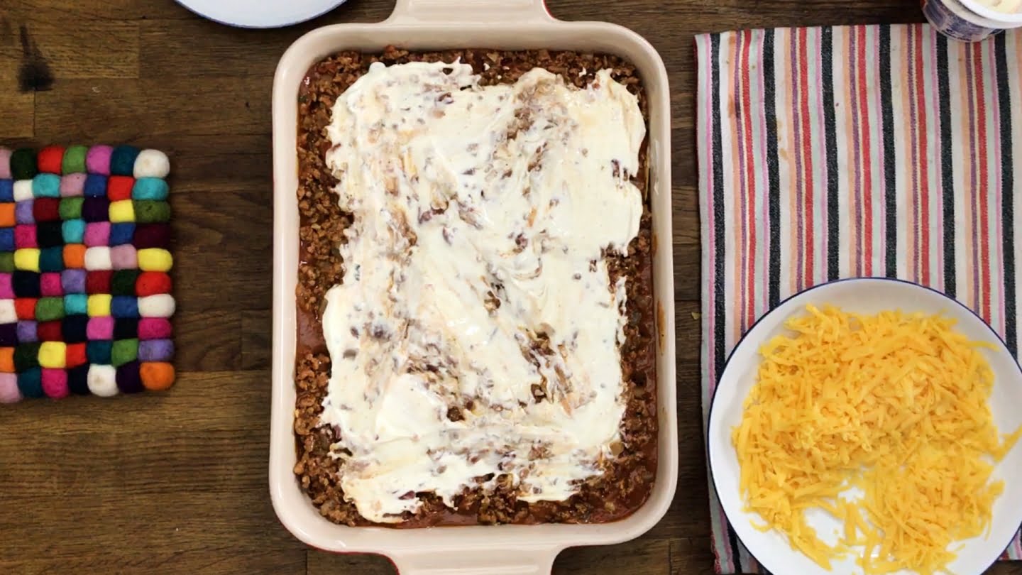 mexican lasagna loaded with  sour cream on top