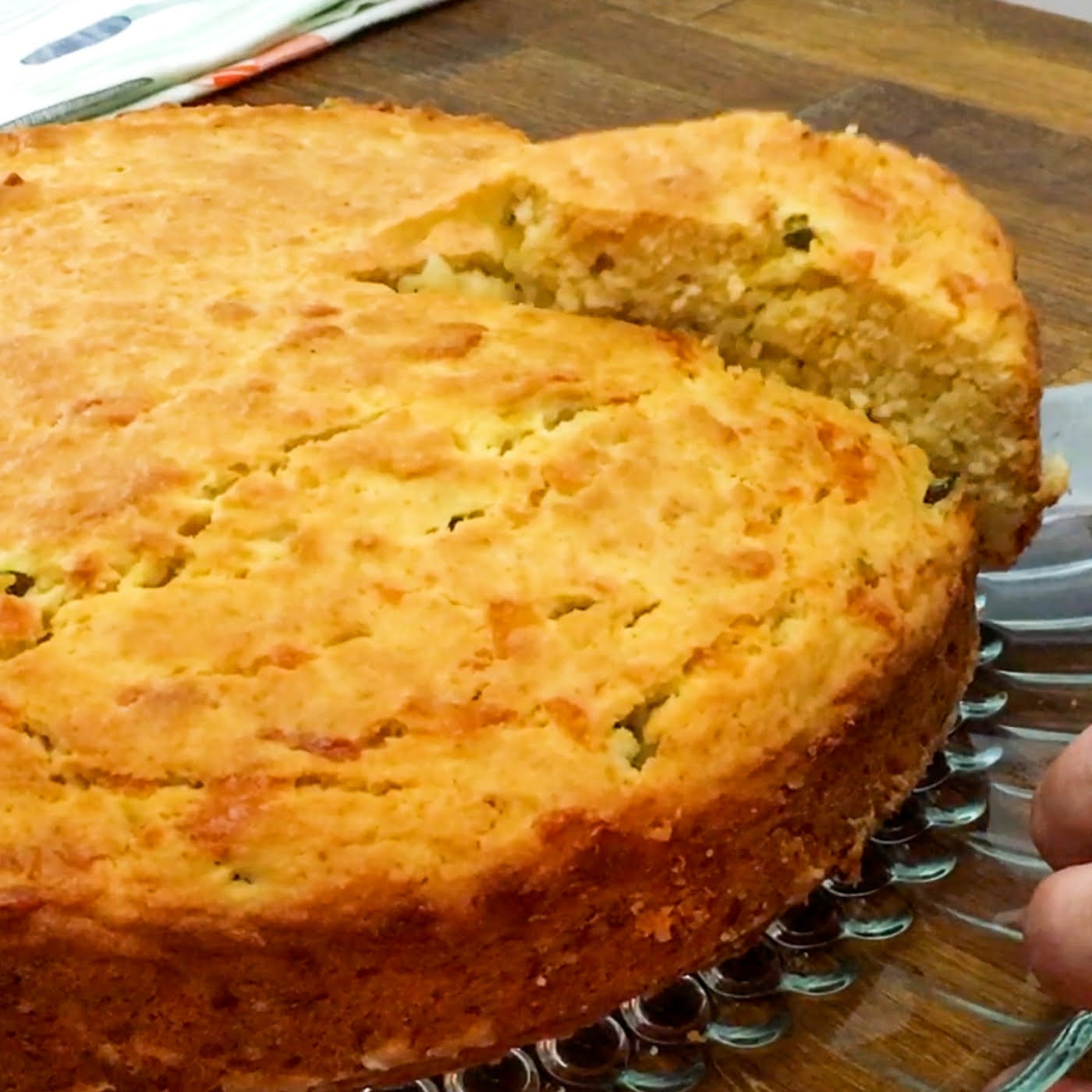 slicing a whole jalapeno cheddar cornbread