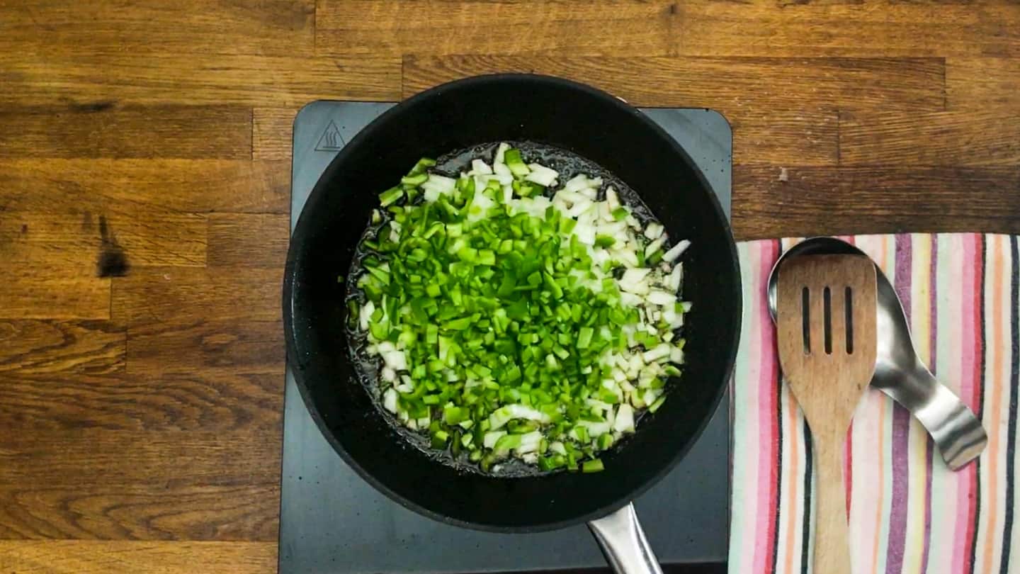 Onions, green pepper cooking in large skillet