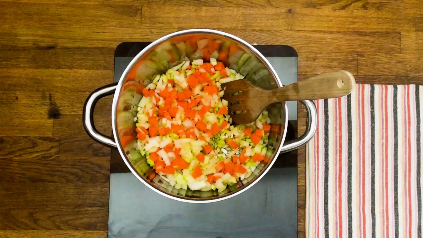 cook carrots, celery stalks, and onions