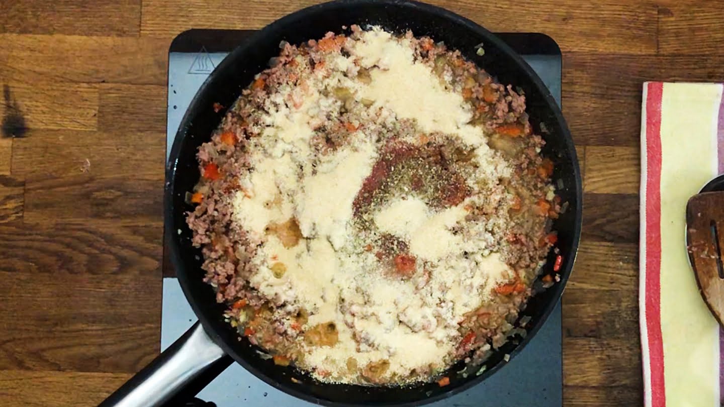 Onion and peppers tomato paste with ground beef and breadcrumbs