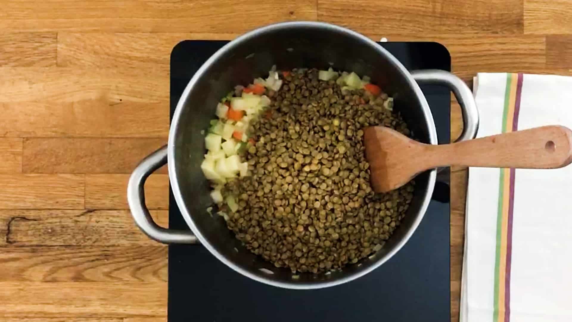 Lentils cooking in a pan
