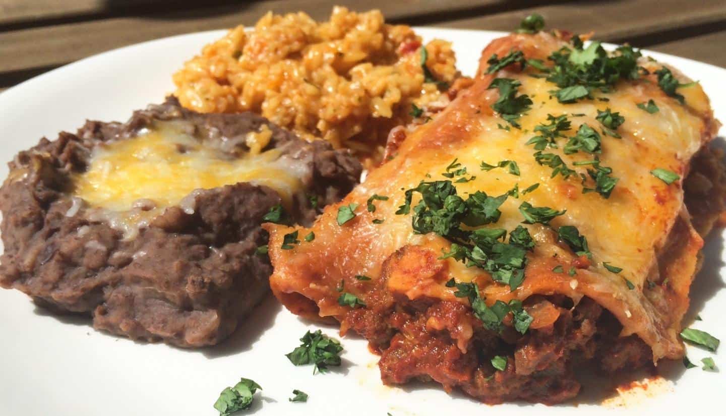 beef enchilada casserole with rice and refried beans