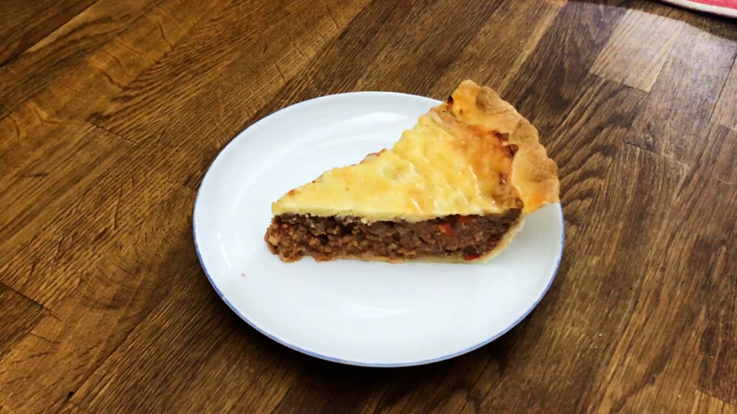 cheeseburger pie slice in a white plate