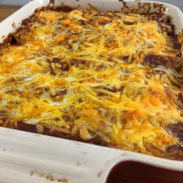 beef enchilada casserole with cheese on top