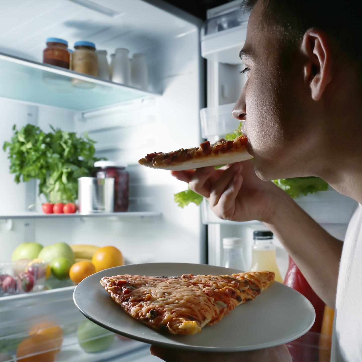 eating pizza from the fridge