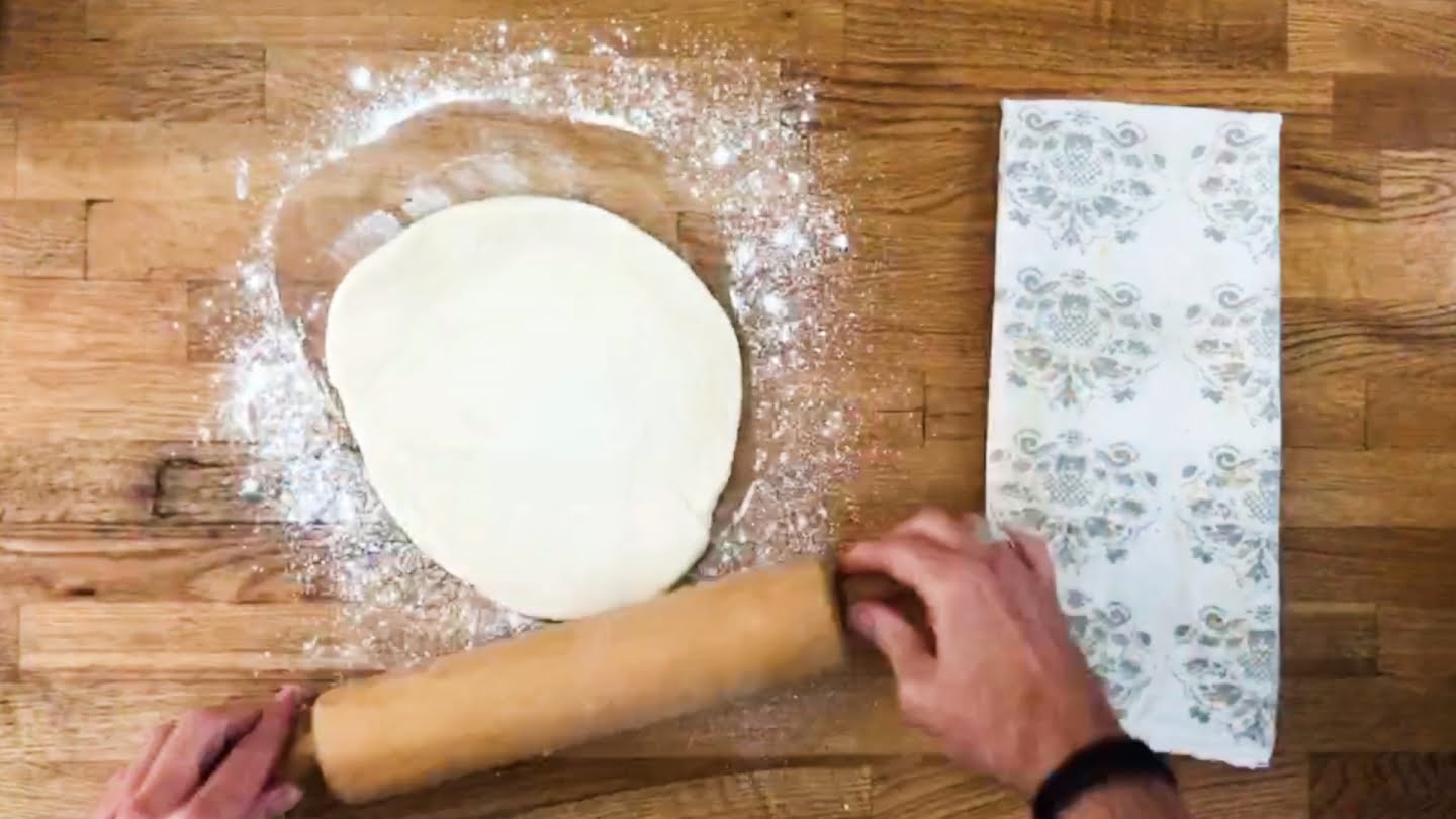Rolling out pizza dough