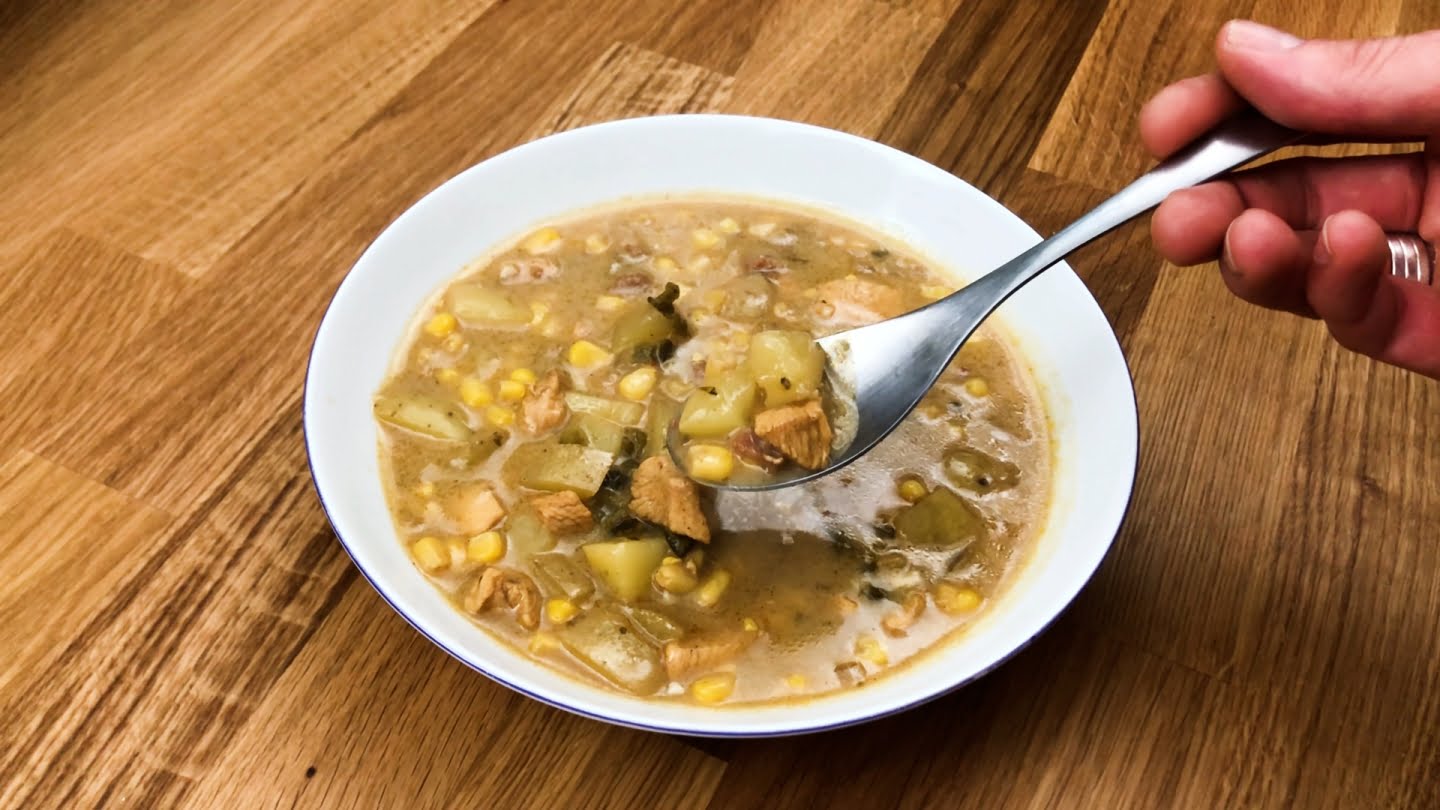  chicken corn chowder soup in a plate with spoon