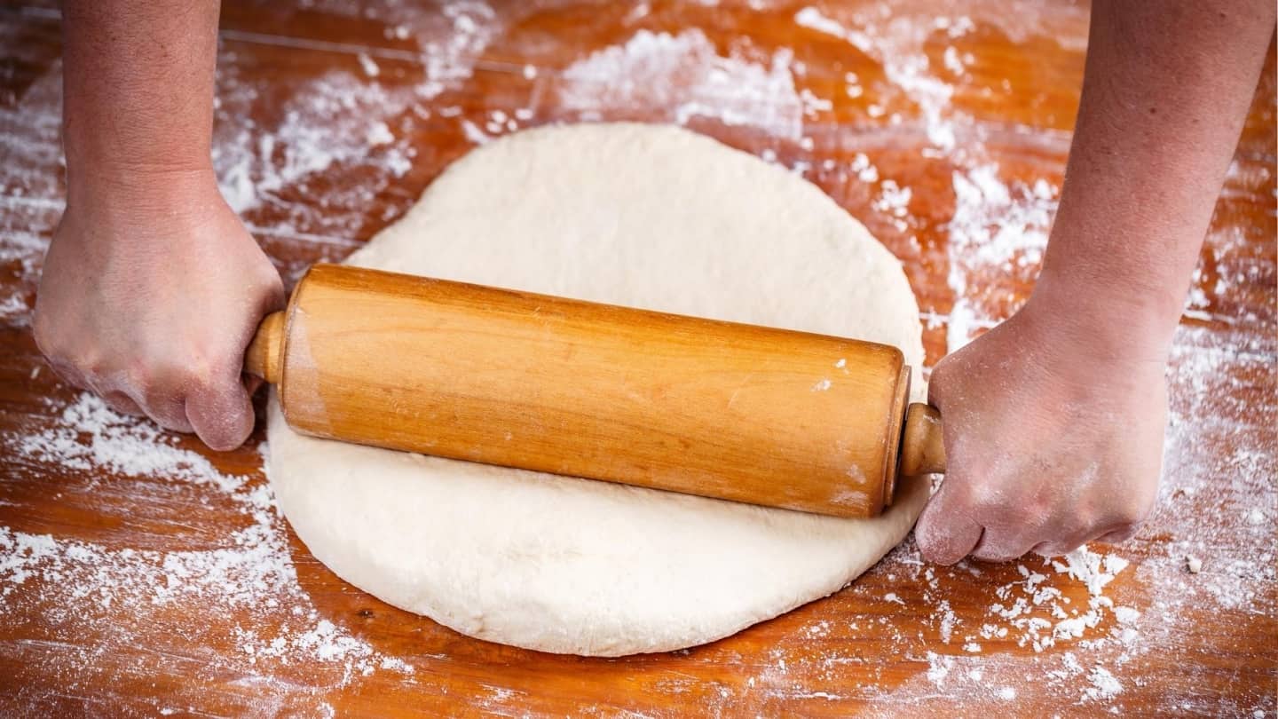 Rolling out pizza dough