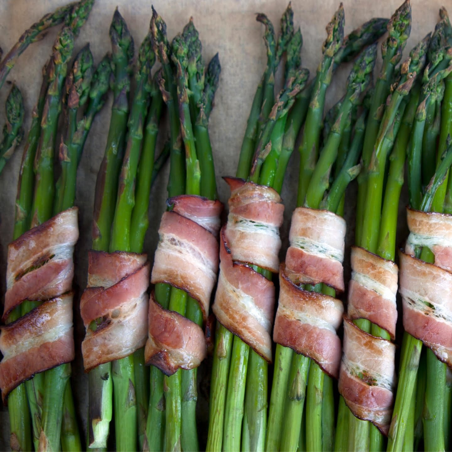 Perfectly baked green asparagus wrapped in bacon.