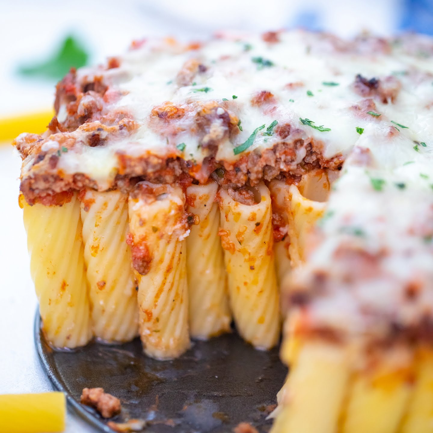 stuffed rigatoni with ground beef and cheese on top