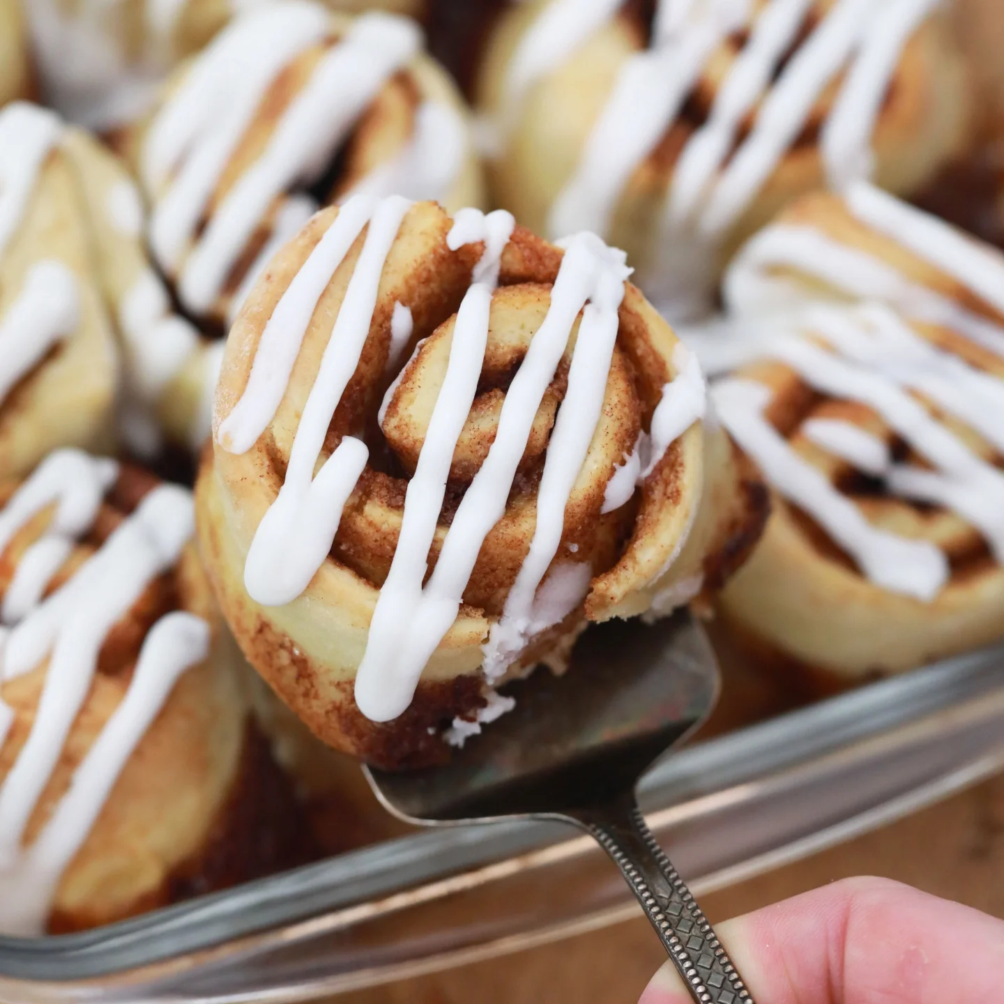 cream cheese, butter, powdered sugar, vanilla, and salt on top of cinnamon roll