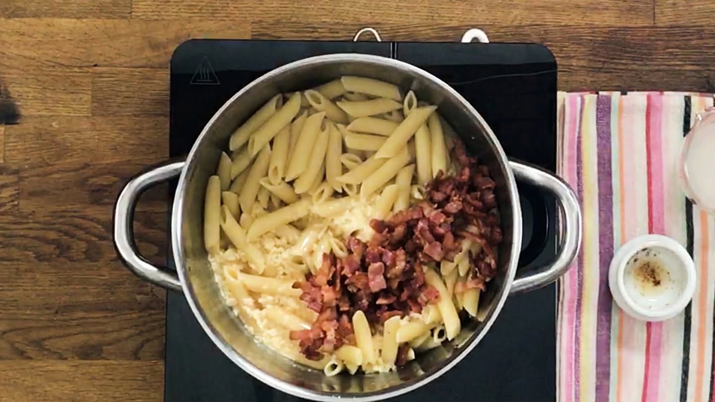 Pasta and bacon cooking