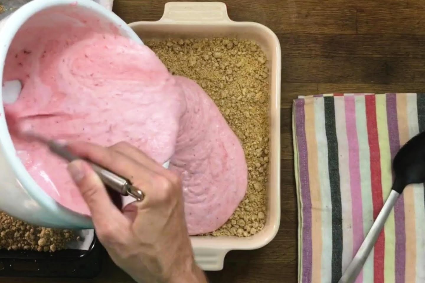 Crumbs and Strawberry Cream Mixture in Glass Dish