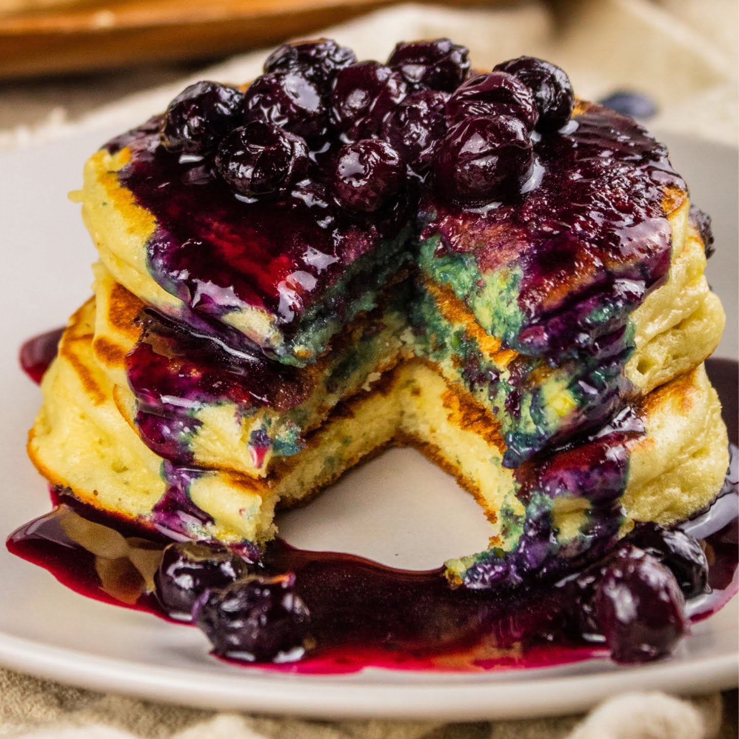 Sour cream pancakes with blueberry sauce