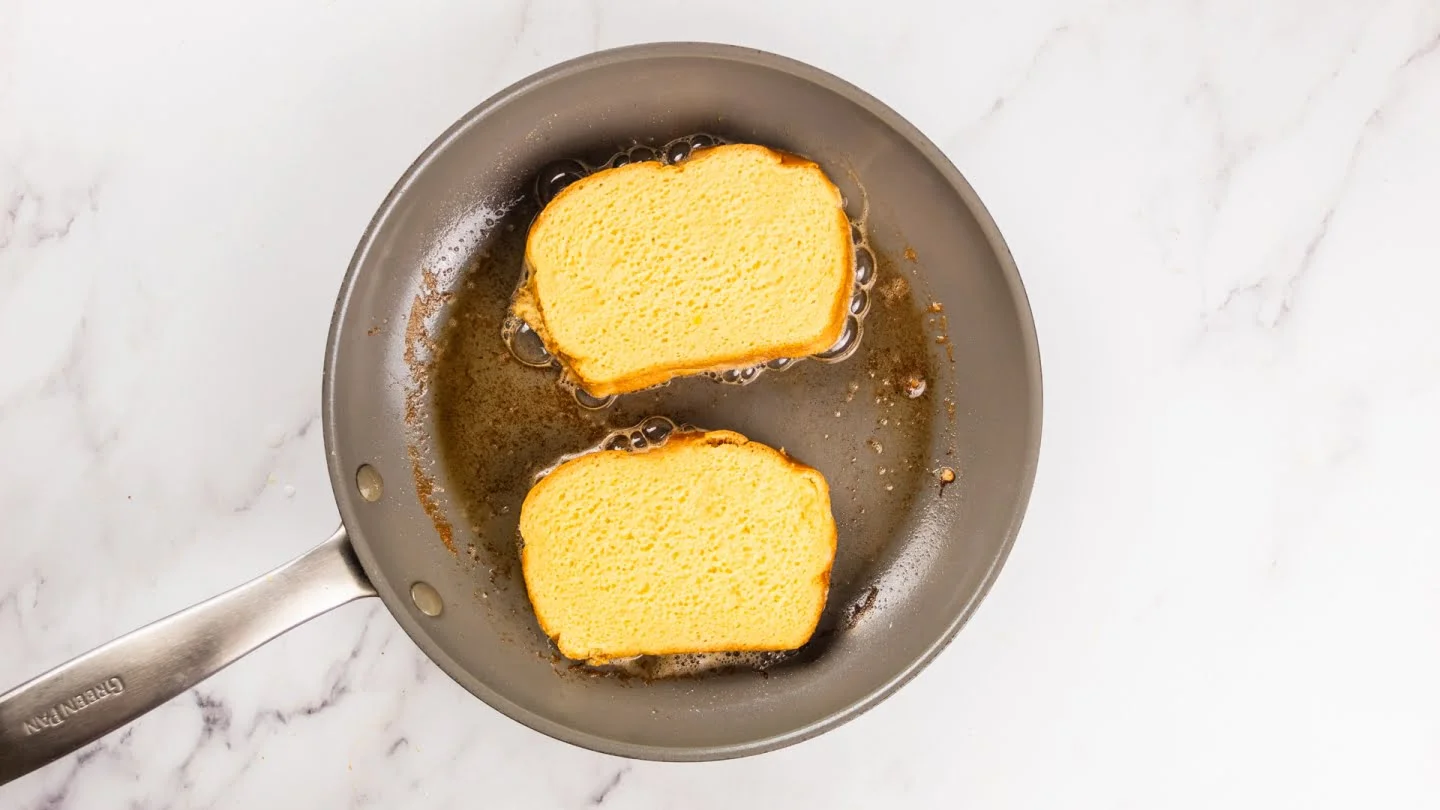 Brioche with egg in skillet