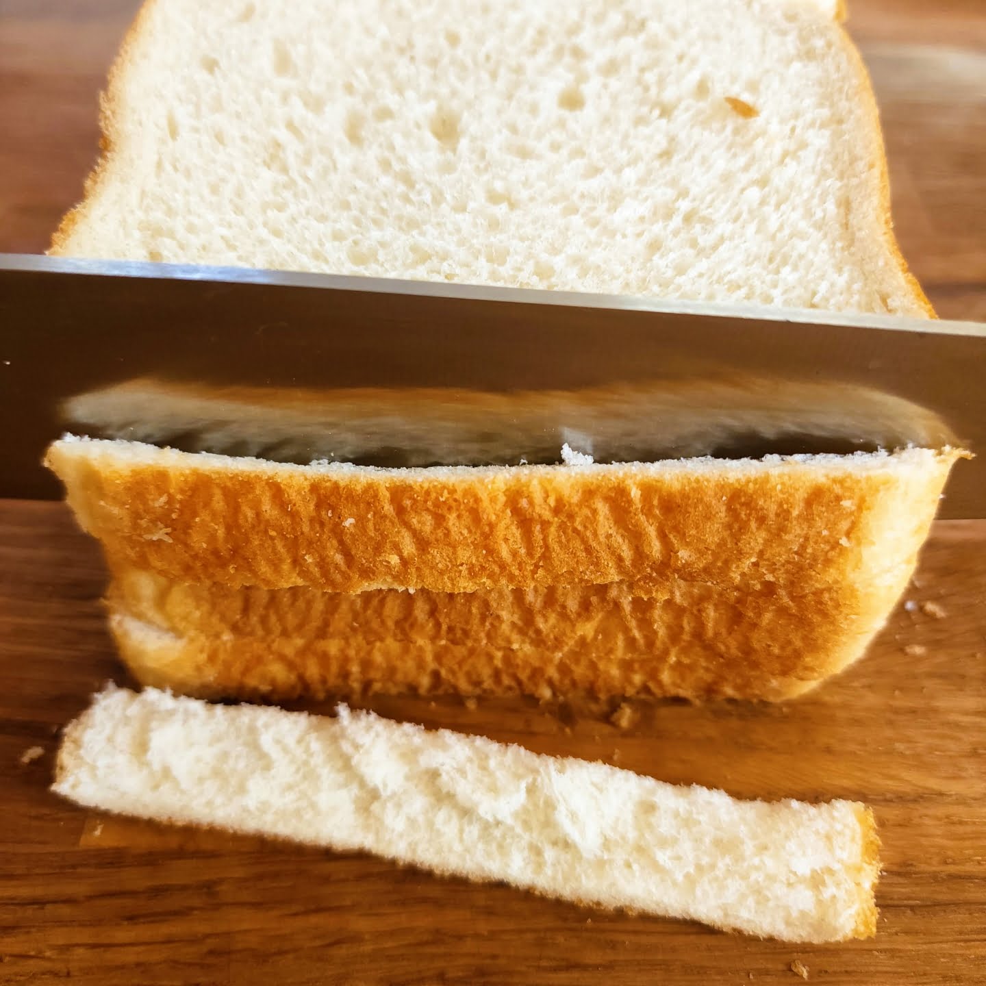 Cutting crust off the bread