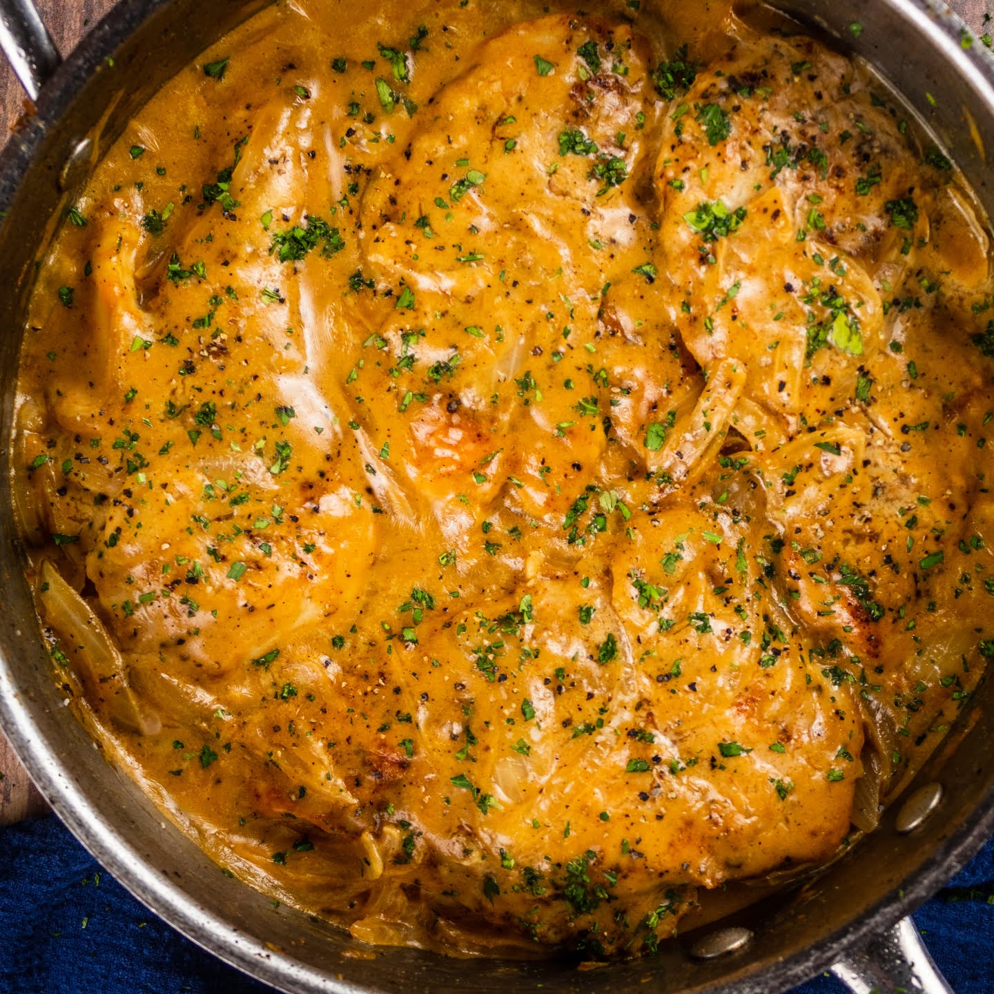 smothered chicken with mashed potato and beans featured