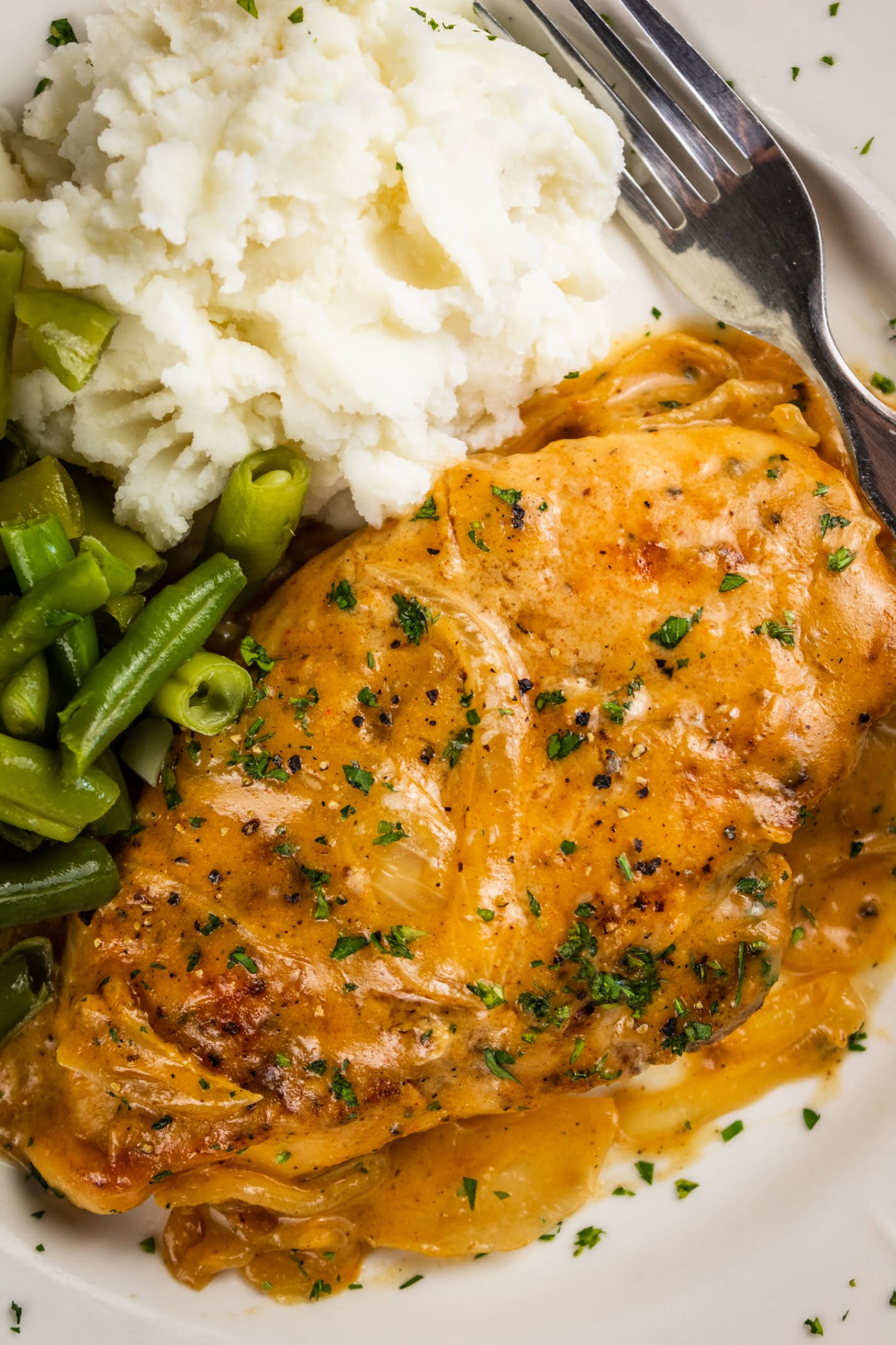 smothered chicken with mashed potato and beans