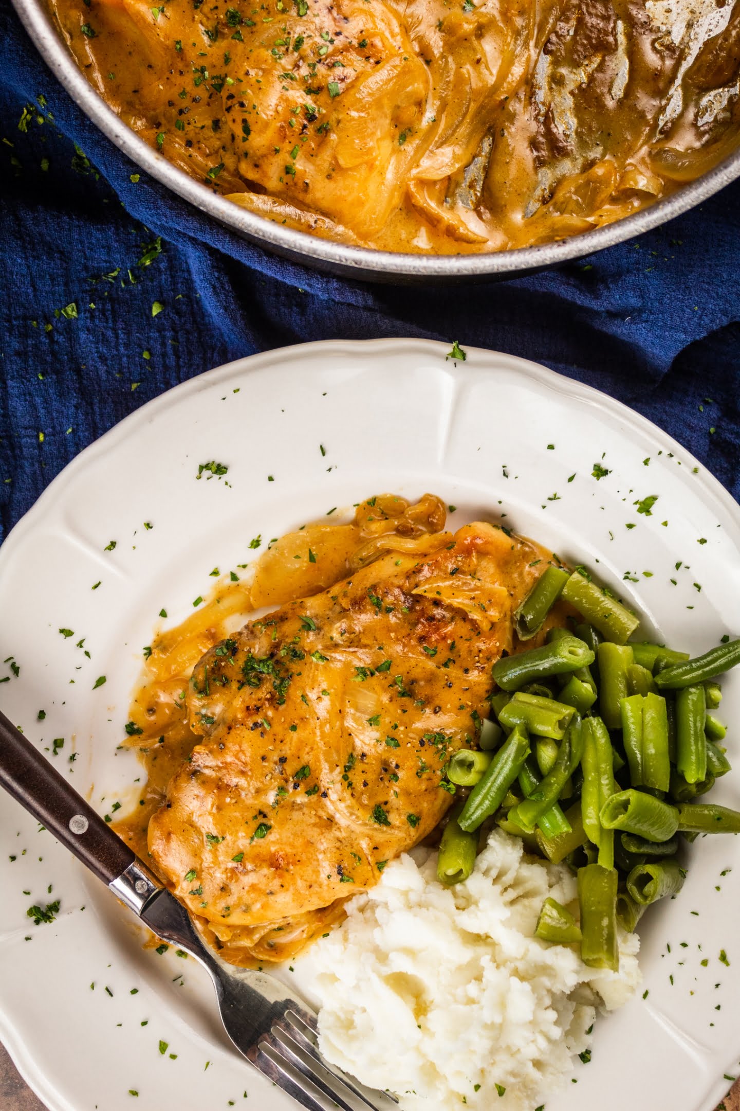 smothered chicken with mashed potato and beans