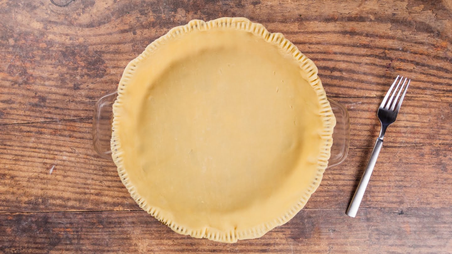 Placing of pie crush in dish