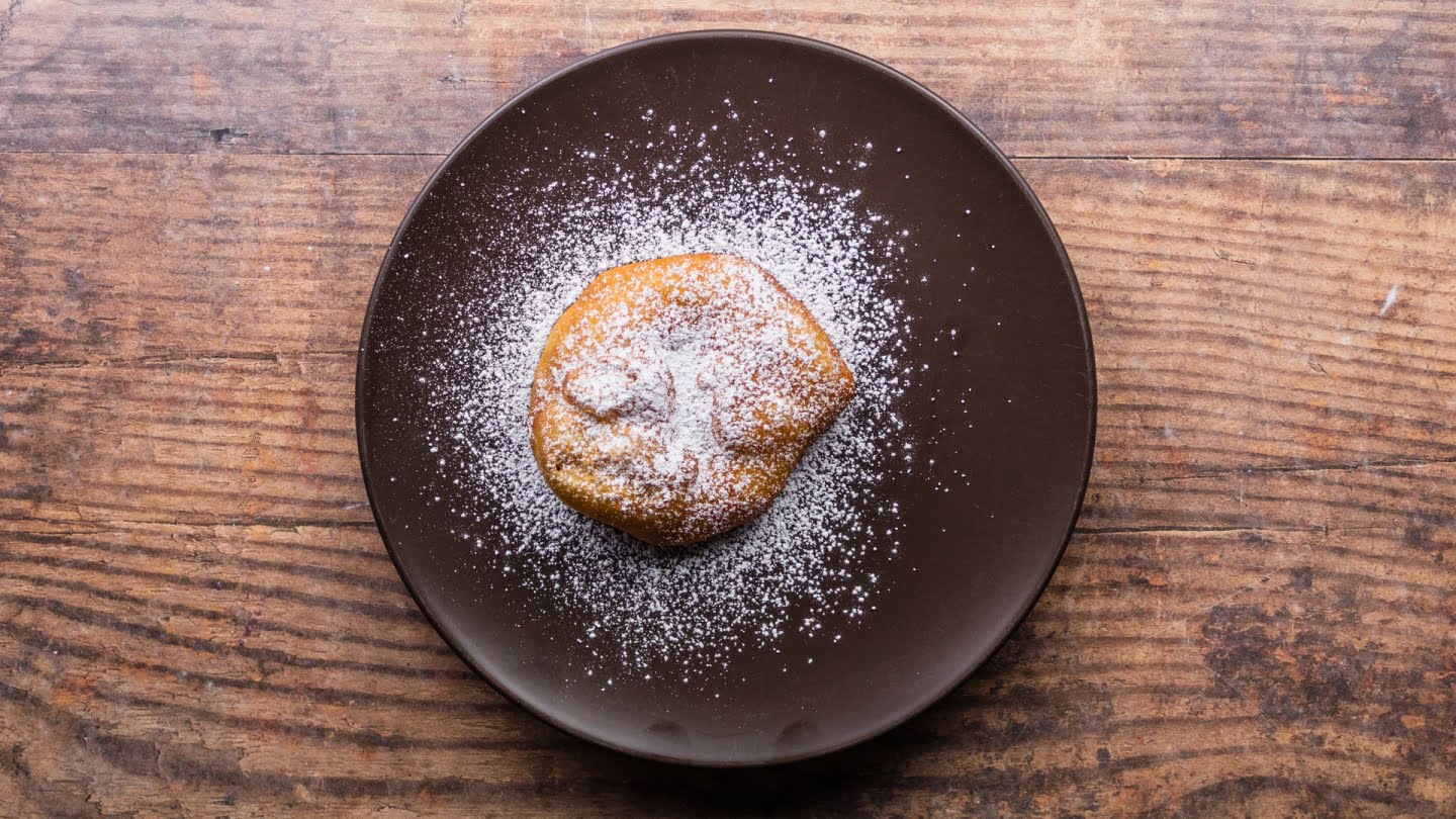 Sprinkle each fried dough with powdered sugar, and enjoy