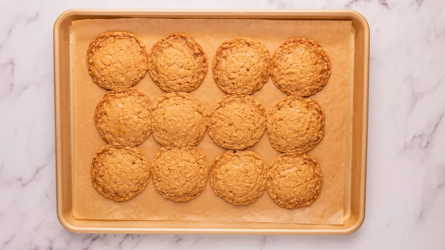 Bake the cookies one baking sheet at a time for 10 minutes each until the edges of the cookies start to brown