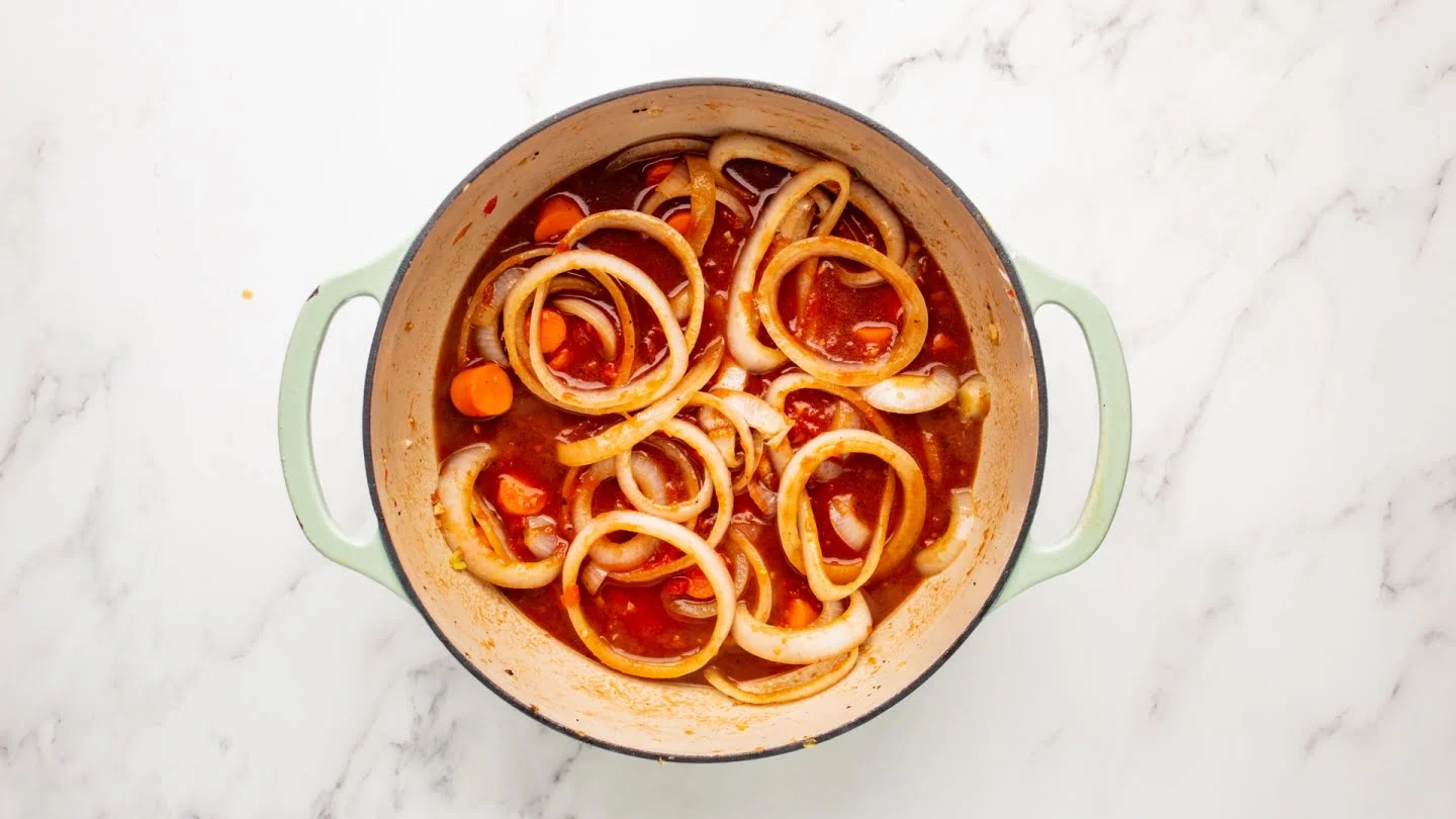  pour in the 2 cups of crushed tomatoes, Worcestershire Sauce, salt, and pepper