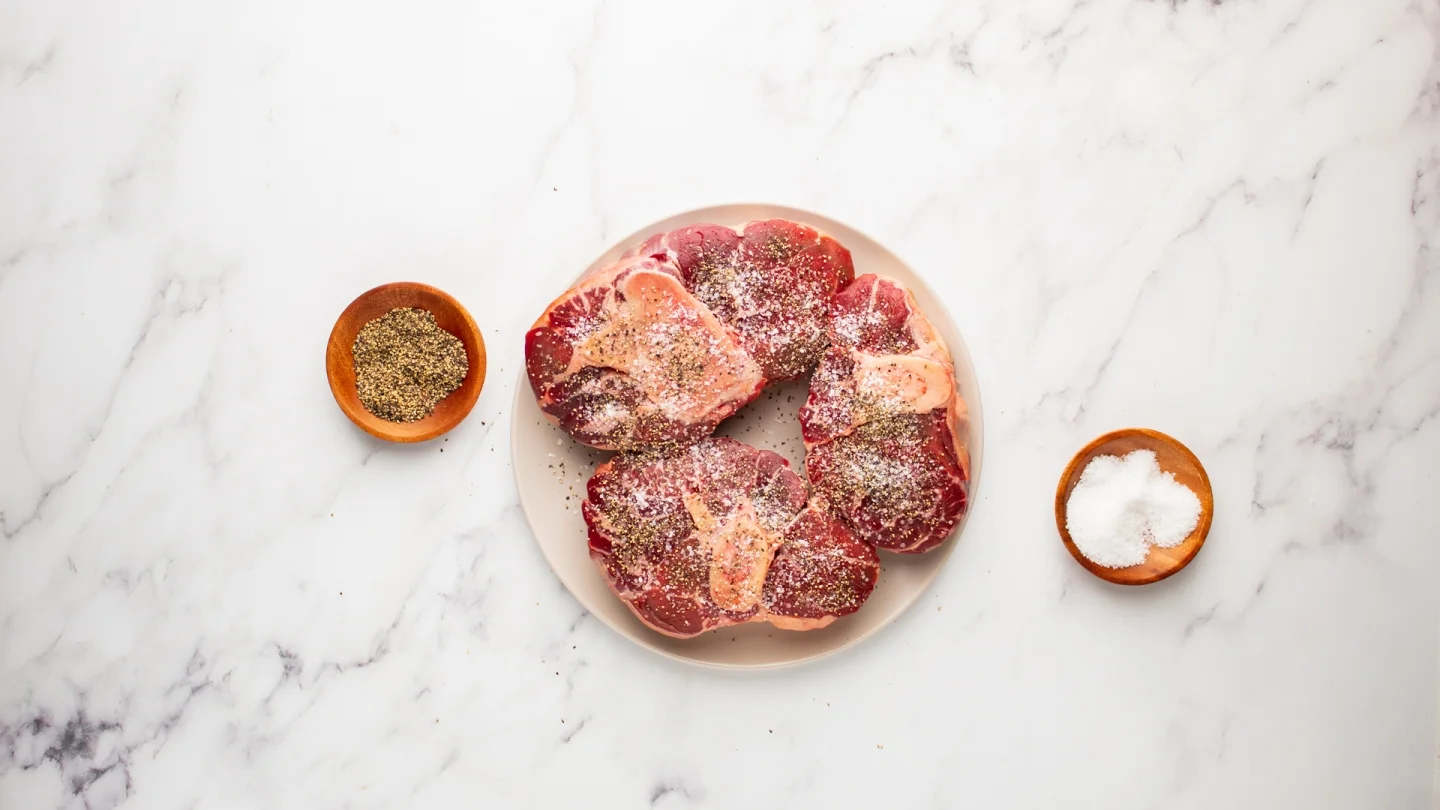 season beef shanks with salt and pepper