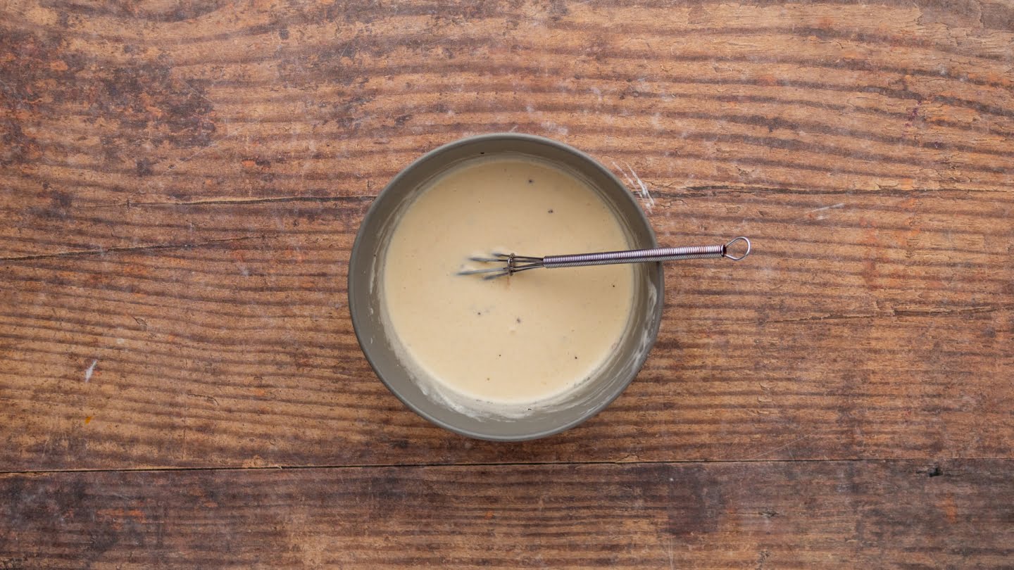 whisk the mayonnaise with the apple cider vinegar, sugar, and seasoning in a medium bowl 