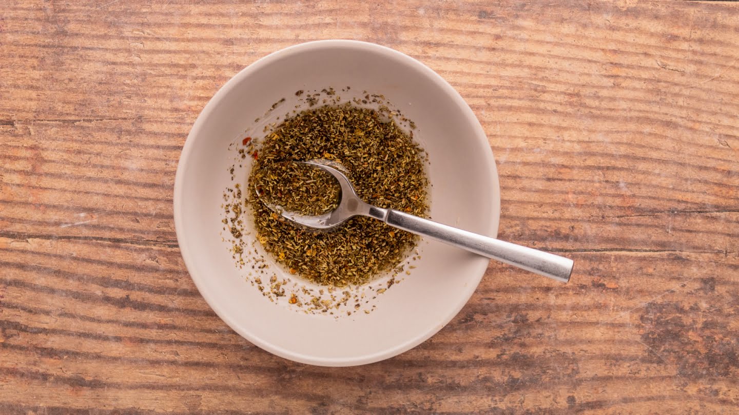 Make the olive oil mixture by mixing the olive oil with Italian seasoning and red pepper flakes in a small bowl