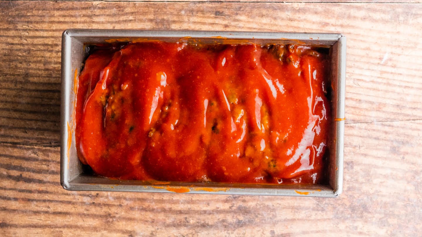 Brush the top of the meatloaf with the meatloaf glaze