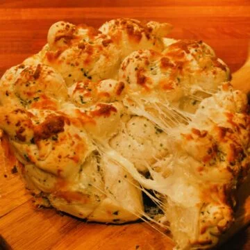 Pulled apart garlic bread featured