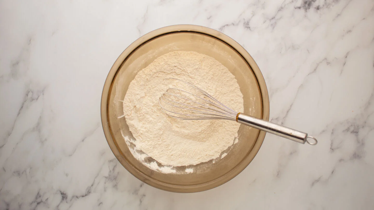 Combine the flour, baking powder, salt, and sugar in a large mixing bowl