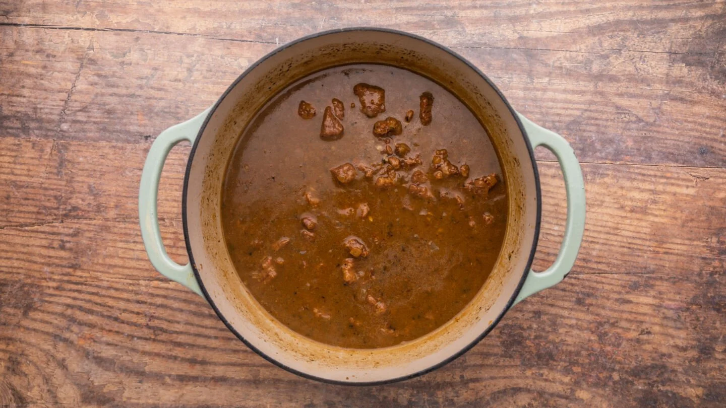 Add the seared beef back into the pot with the remaining ingredients