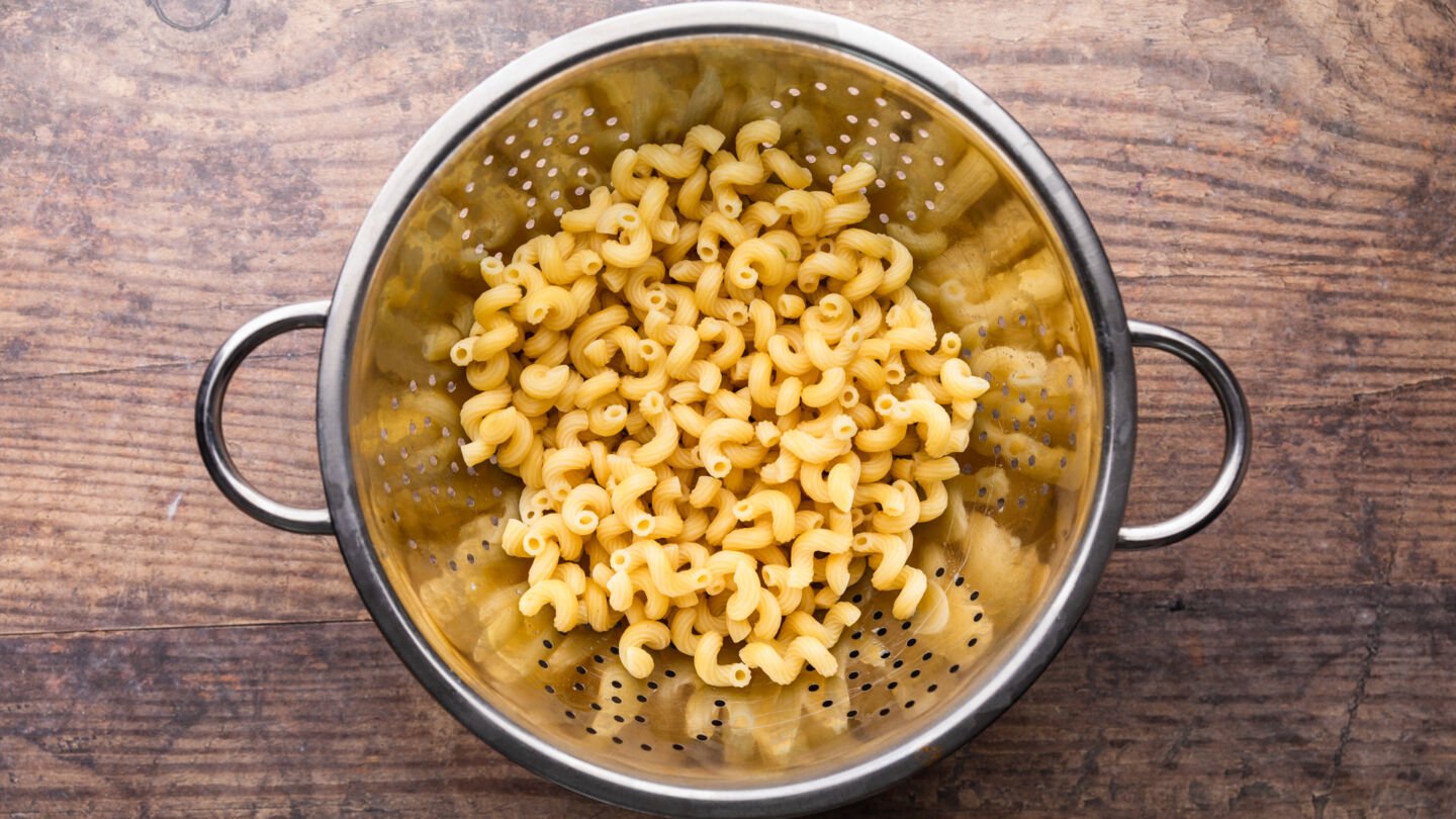 Drain the cooked pasta and rinse it under cold water