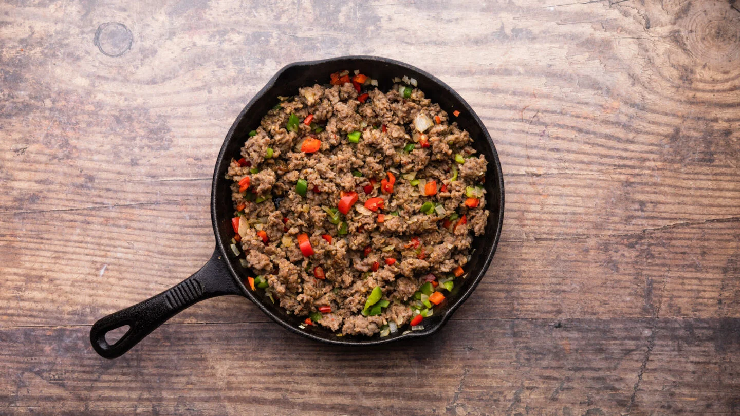  cook the sausage, onions, garlic, and chopped bell peppers for 6 to 8 minutes until the sausage is cooked