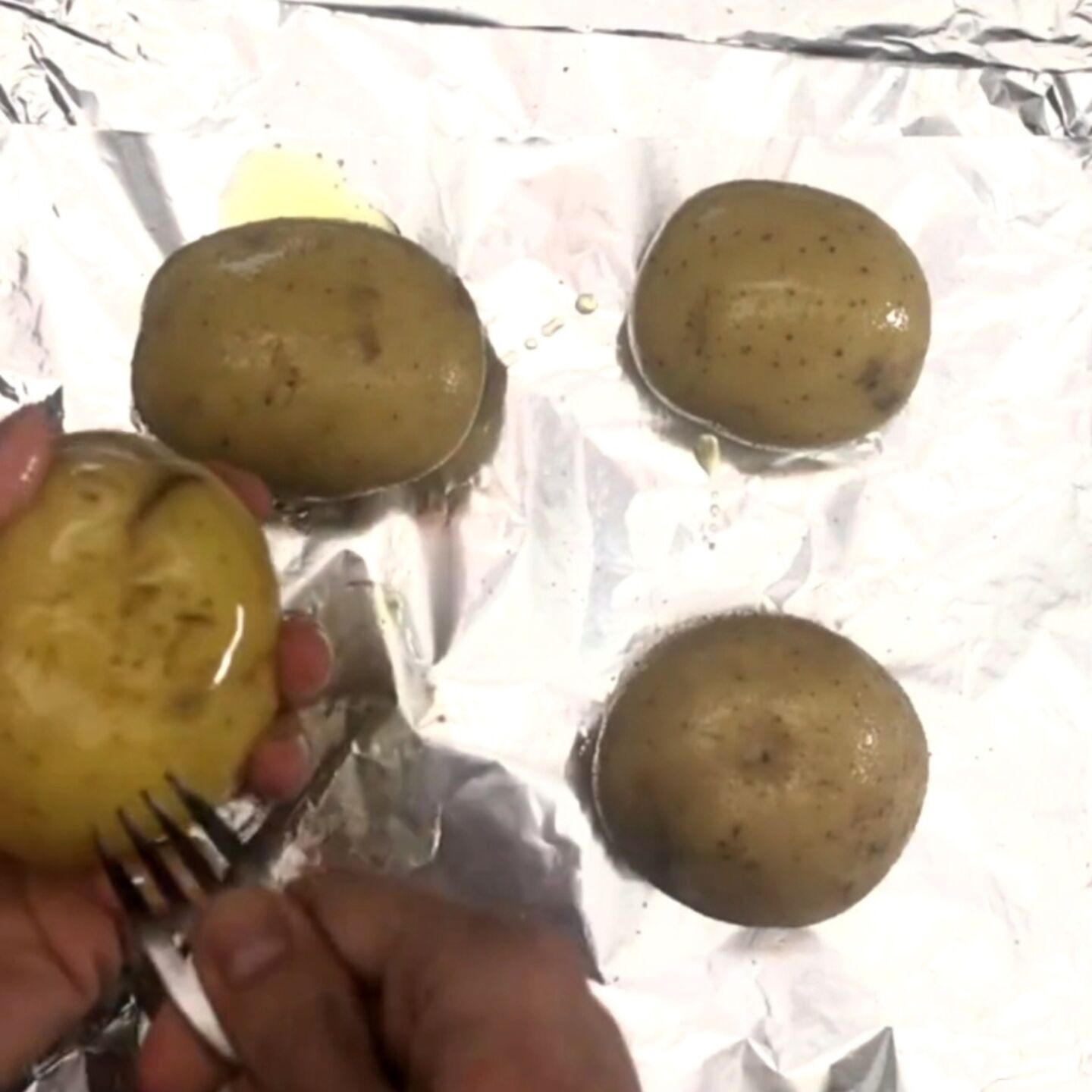 potatoes a few times with a fork  and rub them with olive oil and salt. 