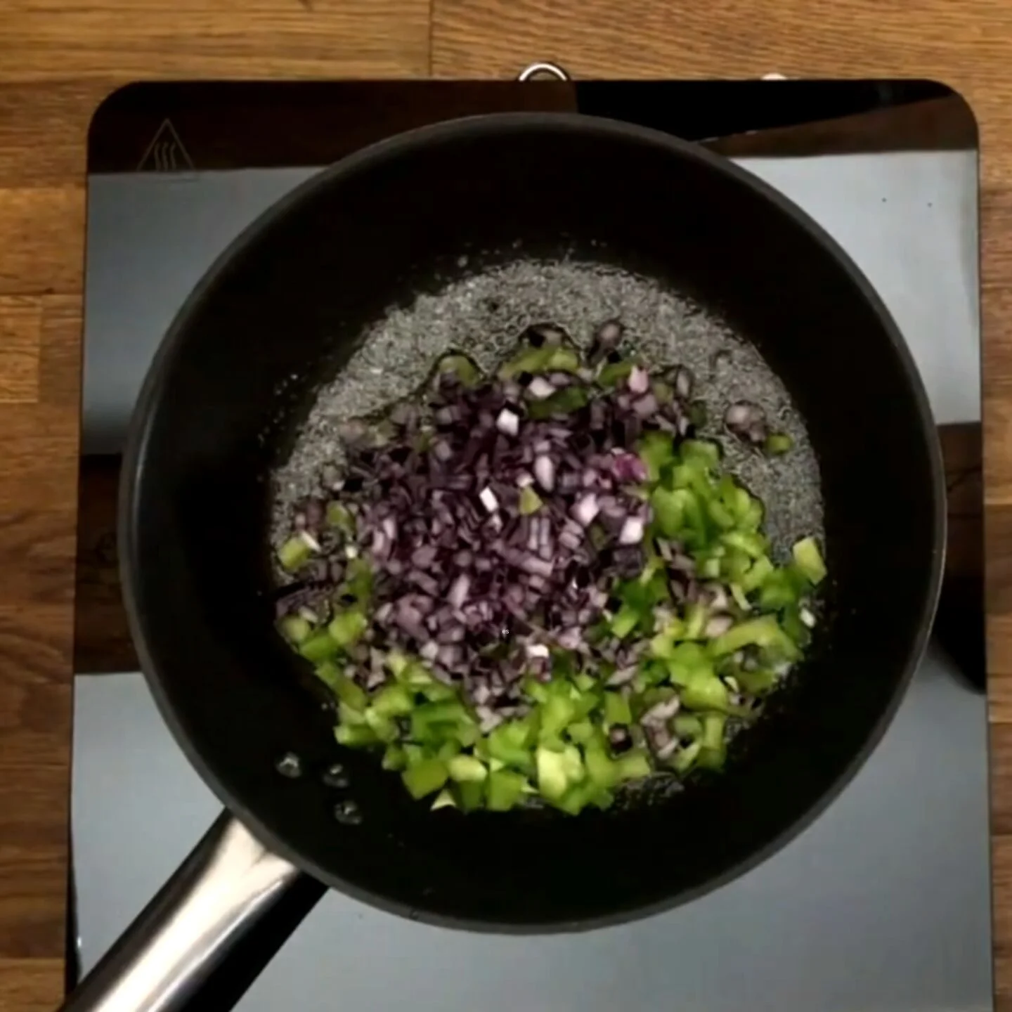 cook the chopped pepper and onion until soft