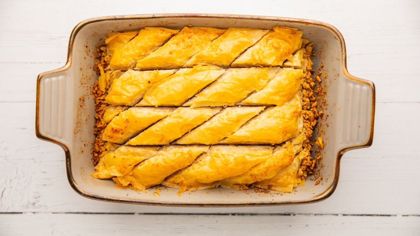 Bake the prepared Greek baklava in the preheated oven for 50 minutes until golden brown and crispy