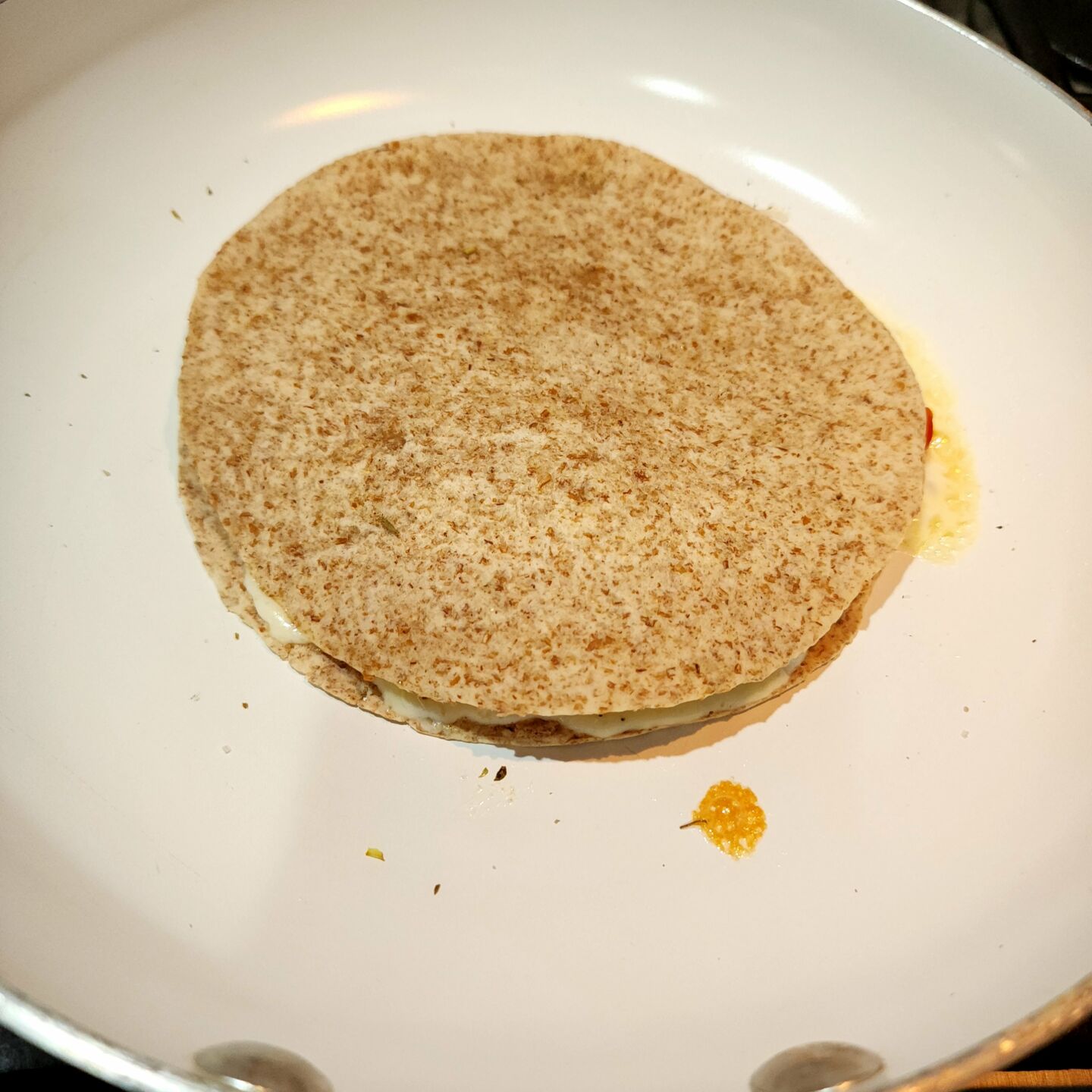 Place another tortilla on top and cook for 2 to 3 minutes before flipping