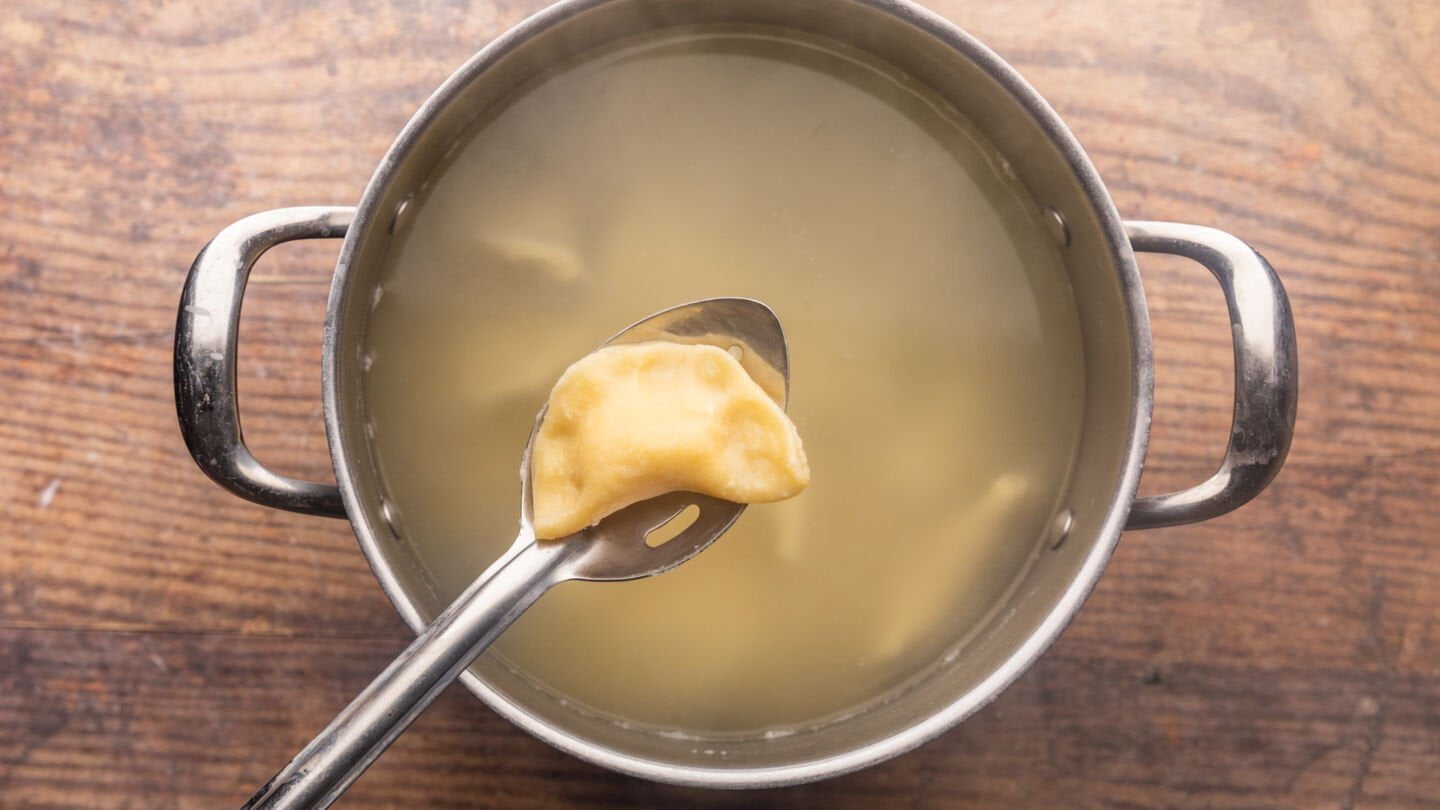 Bring a pot of salted water to a boil and gently drop half of the pierogi in the boiling water