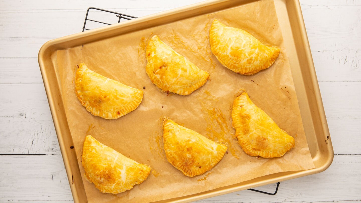 Bake the pizza pockets in the preheated oven for 20 to 25 minutes until lightly browned